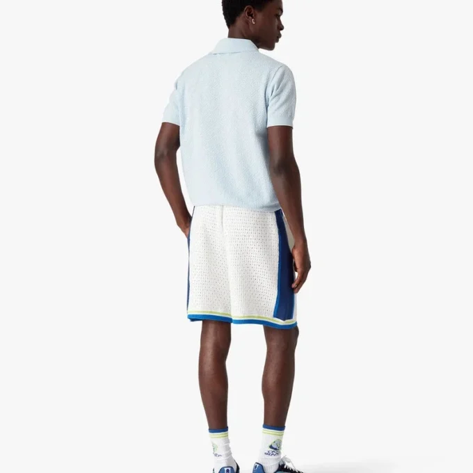 Blå kortärmad pikétröja med Pointelle-monogram