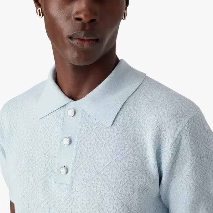 Blå kortärmad pikétröja med Pointelle-monogram