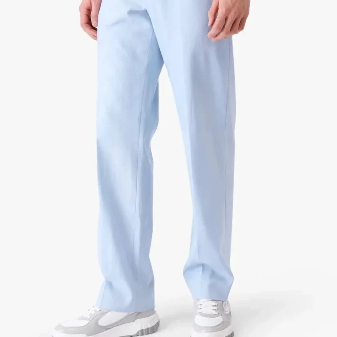 Blå skräddarsydda jacquardbyxor med monogrammönster