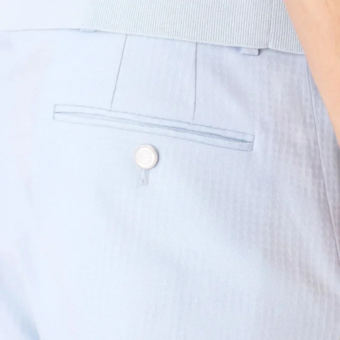 Blå skräddarsydda jacquardbyxor med monogrammönster