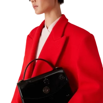 Jeanne-väska med svarta emblem