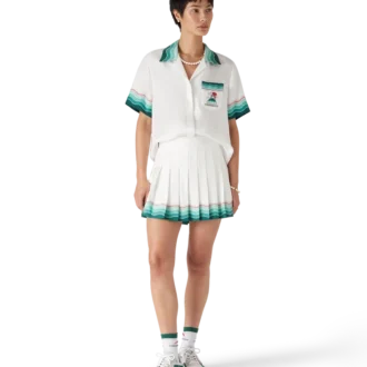 Tennisplisserad minikjol i siden