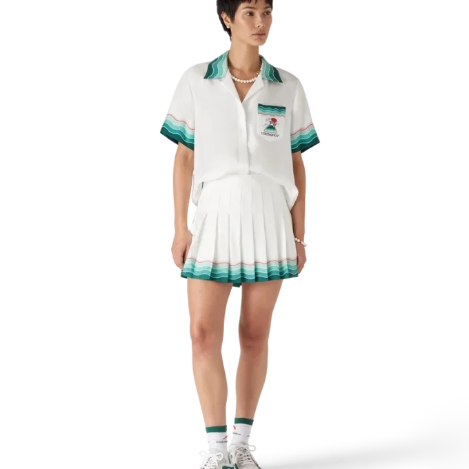 Tennisplisserad minikjol i siden