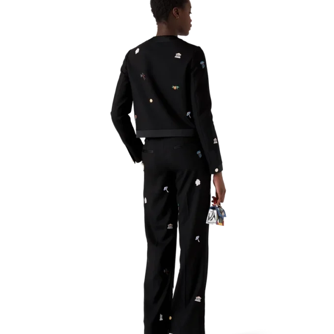 Skräddarsydda byxor i ull med broderat motiv