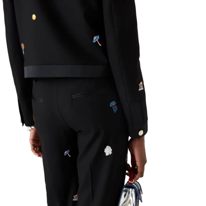 Skräddarsydda byxor i ull med broderat motiv