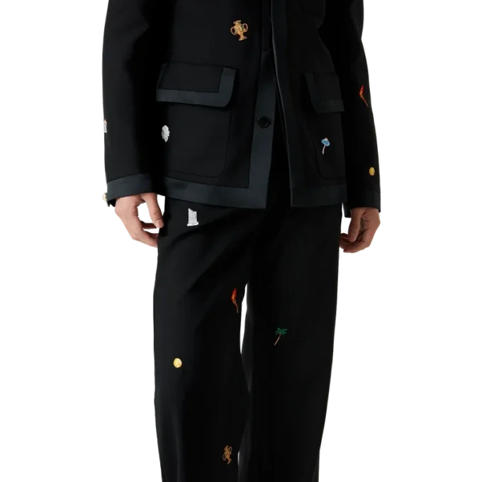 Skräddarsydda byxor i ull med broderat motiv