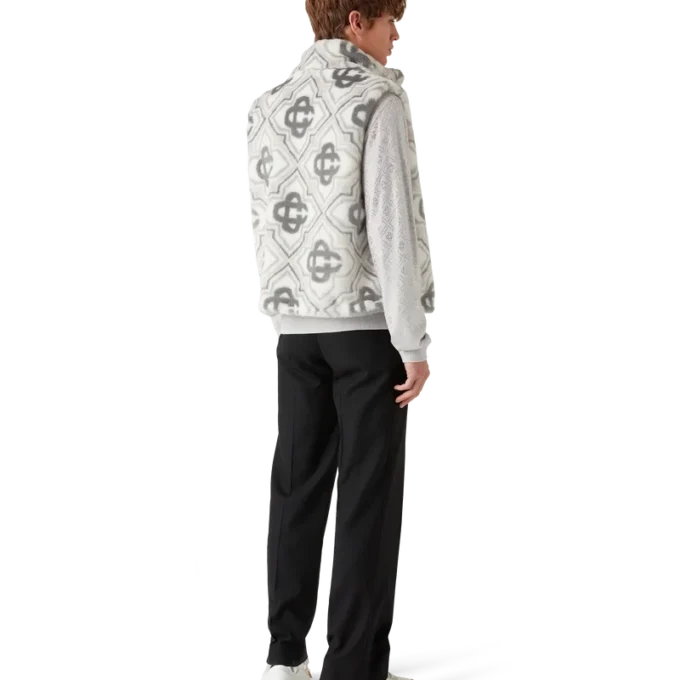 Väst i fuskpäls med monogram